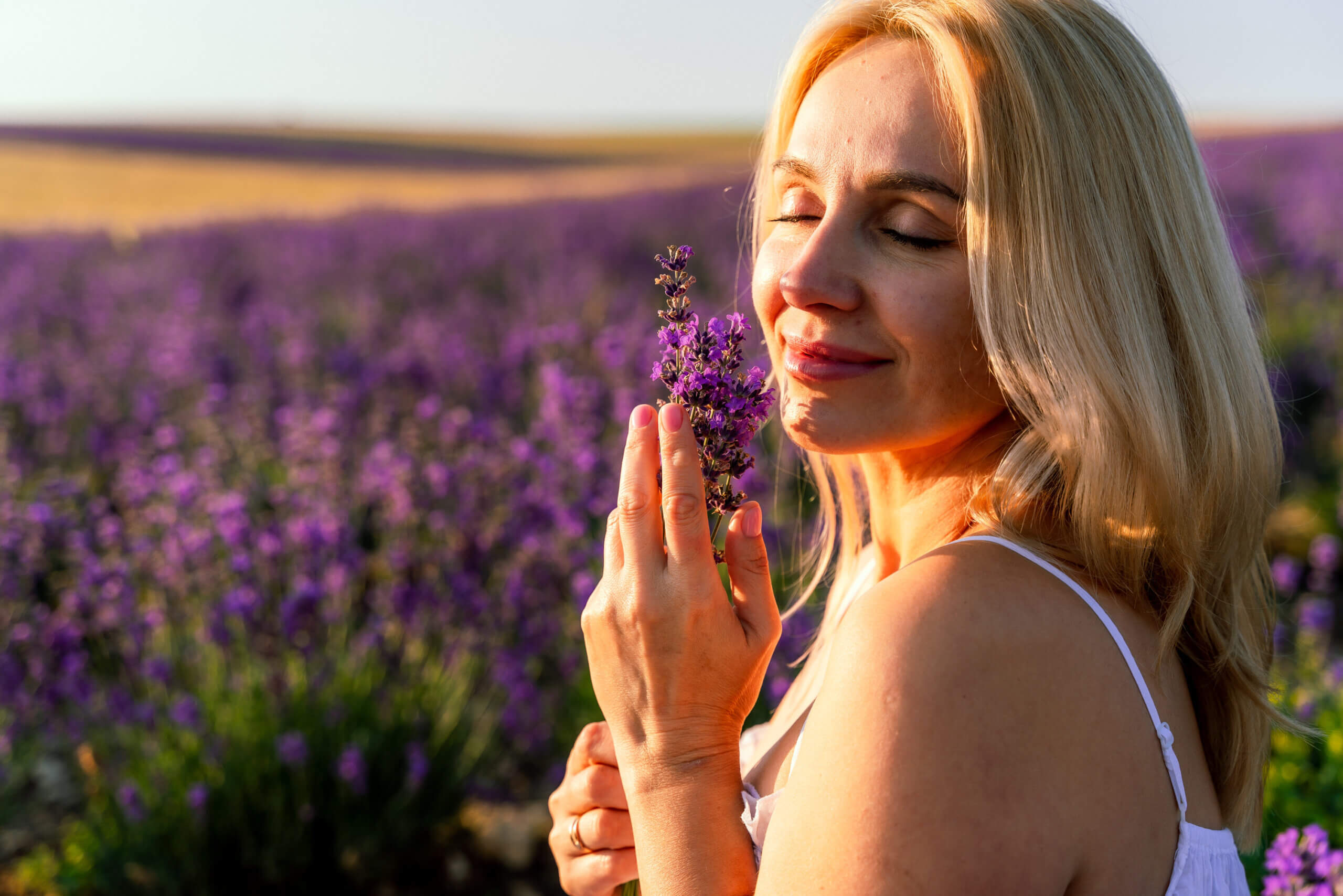 woman holding lavender flower